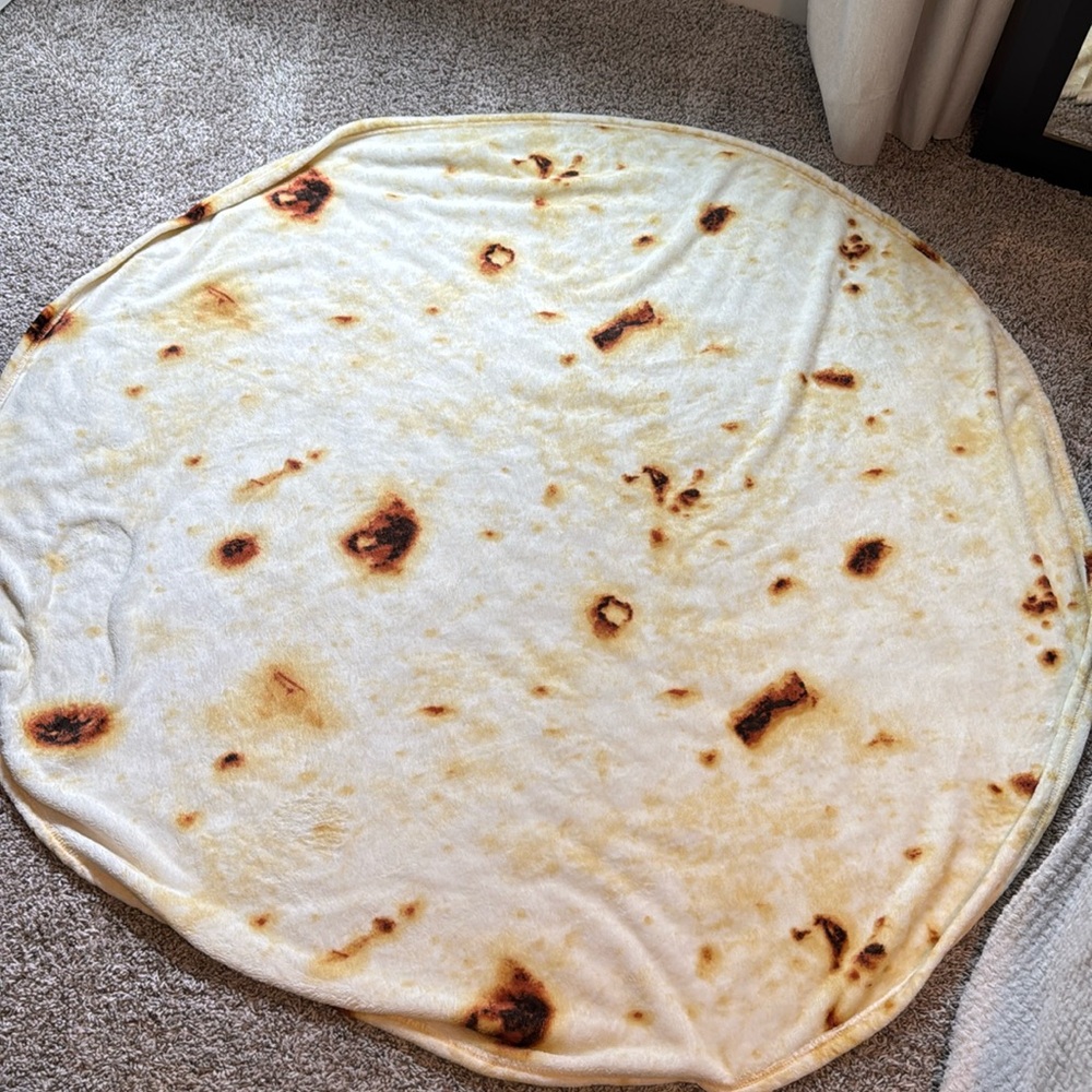 Plush tortilla shaped blanket.